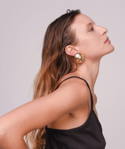 Oversized gold clip buttons